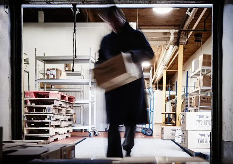 Boxes of meat being loaded for delivery at Two Rivers' warehouse