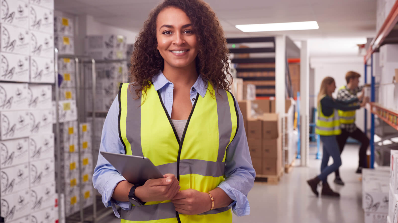 warehouse manager holding an iPad