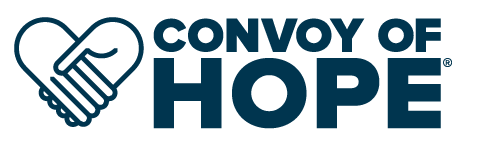 A blue and white logo for a website called Conversations with a Purpose.