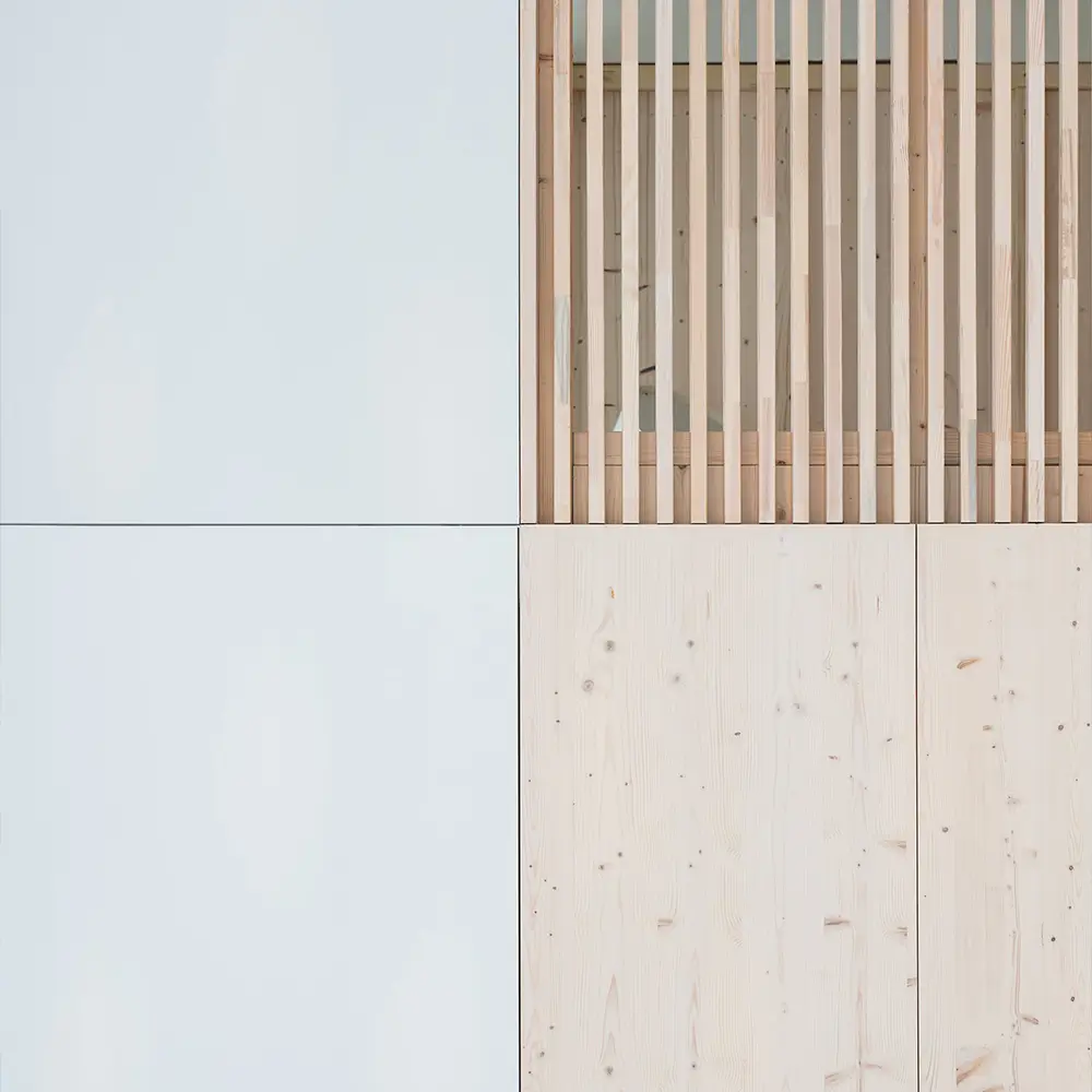 Two small walls with wooden slats in between, designed in a minimalist abstraction style, inspired by the Pont-Aven school and half-timbered construction, which represent abstract architecture.