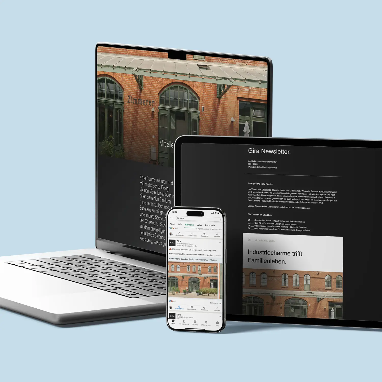 Digitale Darstellung eines architektonisch sanierten Industriegebäudes auf Laptop, Tablet und Smartphone mit Gira-Branding und Newsletter-Inhalten.