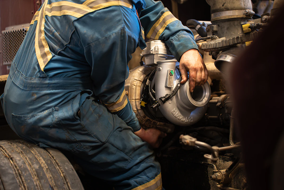 mechanic working on a brake