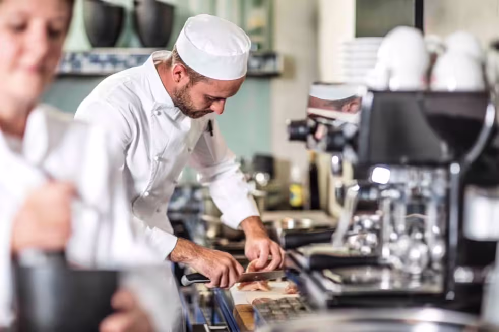 Chef preparing food in a commercial kitchen