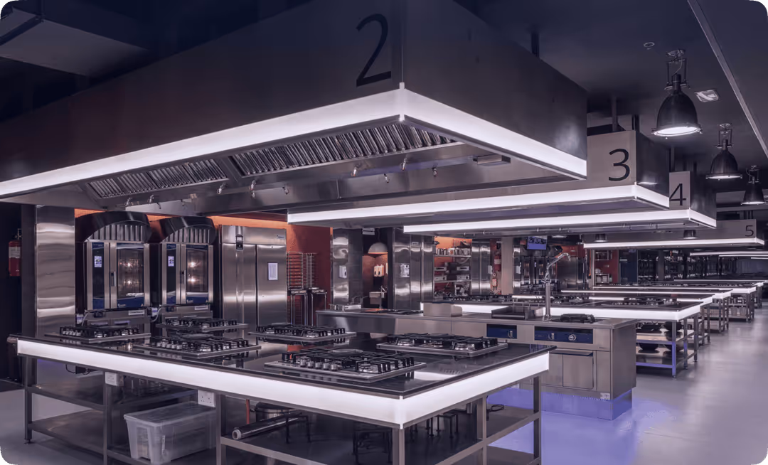 A kitchen with a lot of stainless steel appliances.