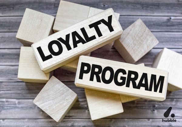 Wooden blocks with "Loyalty Program" written on them, representing successful customer loyalty strategies used by top brands.