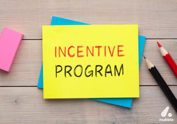 Sticky note with "Incentive Program" written on it, representing strategies for designing effective channel incentive programs.