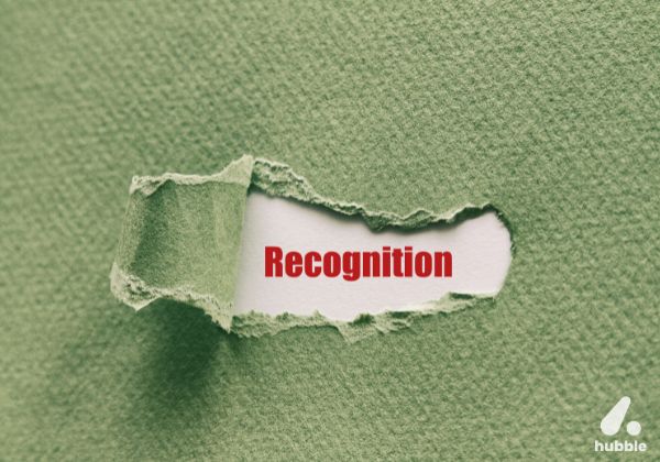 Torn green paper revealing the word "Recognition," representing the importance of real-time recognition.