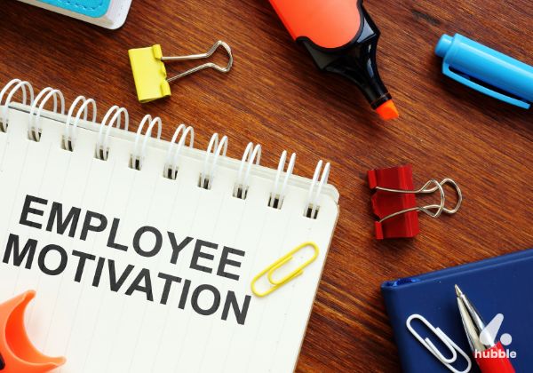 Notebook with "Employee Motivation" written on it, symbolizing the role of behavioral science in workplace motivation