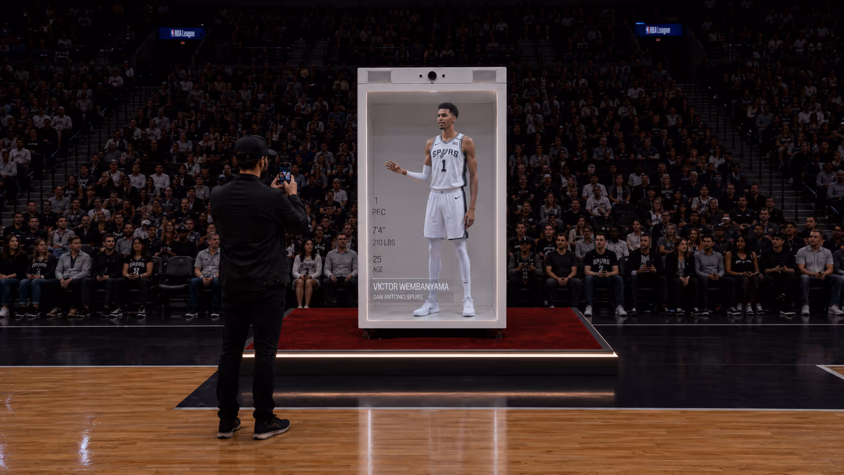 Life-size HoloBox displaying a live holographic basketball athlete with two-way interaction during a sports broadcasting event.