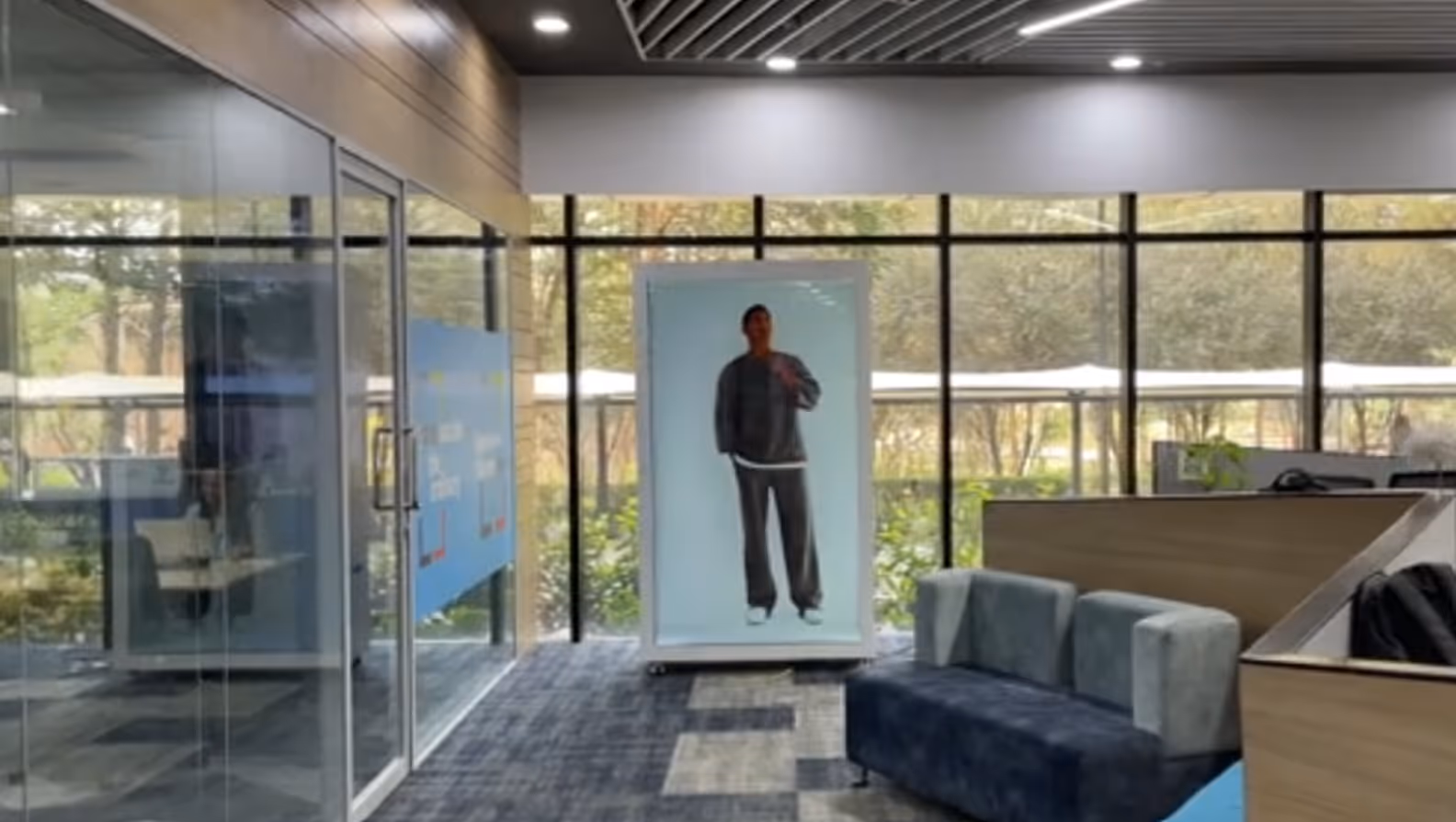 Holographic display in a corporate office corridor, HoloBox911