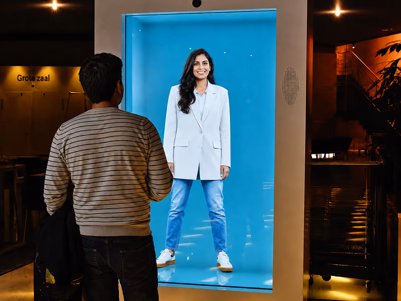 Life-size HoloBox911 hologram used as a talent-acquisition experience at a campus recruitment stand