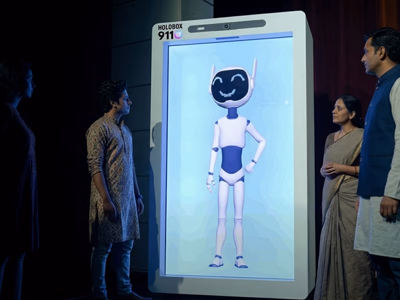 Futuristic AI avatar hologram running on a HoloBox911 display in an innovation lab