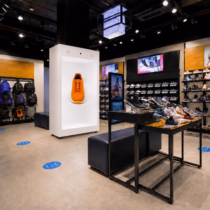 Life-size HoloBox displaying a 3D holographic shoe in a retail store to improve customer engagement, product analytics, and interactive shopping.