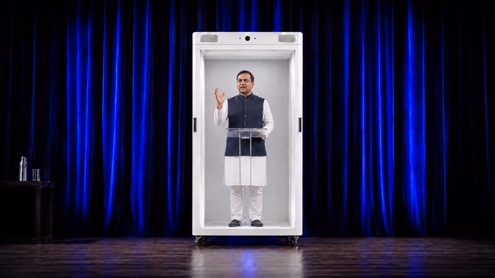 Life-size HoloBox displaying a holographic keynote speaker on stage during a live conference, creating an immersive 3D event experience.