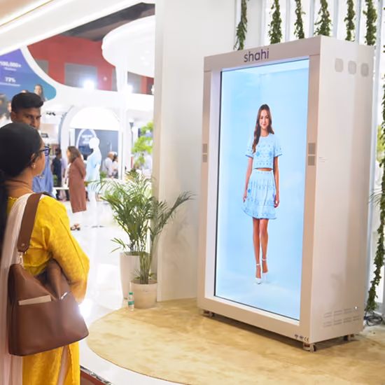 Holographic fashion runway displaying a Shahi garment in HoloBox911