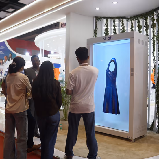 Buyers reviewing Shahi garments using HoloBox911 digital display