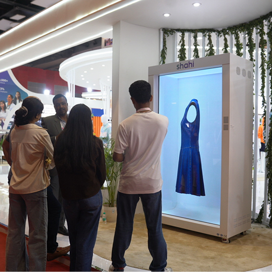 Buyers reviewing Shahi garments using HoloBox911 digital display