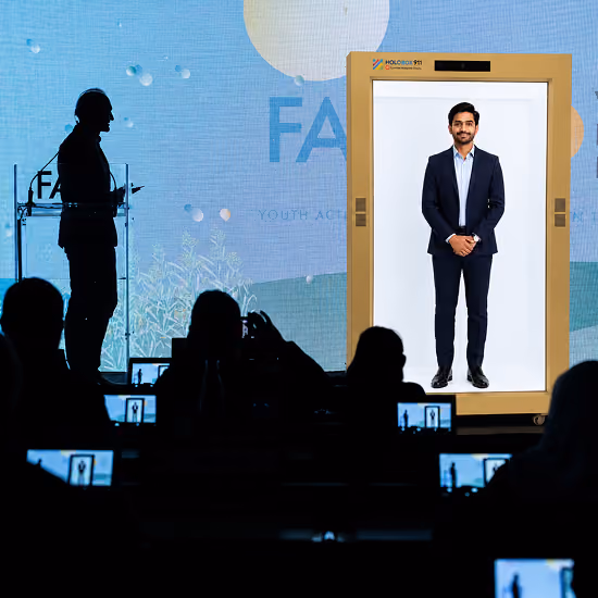 HoloBox911 delivering life-size holographic presenters for exhibitions, trade shows, conferences, and live business events.
