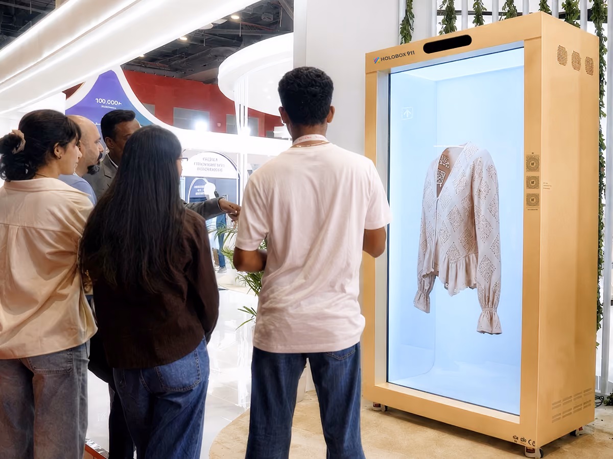 HoloBox 3D hologram display showcasing a life-size holographic person in a retail environment