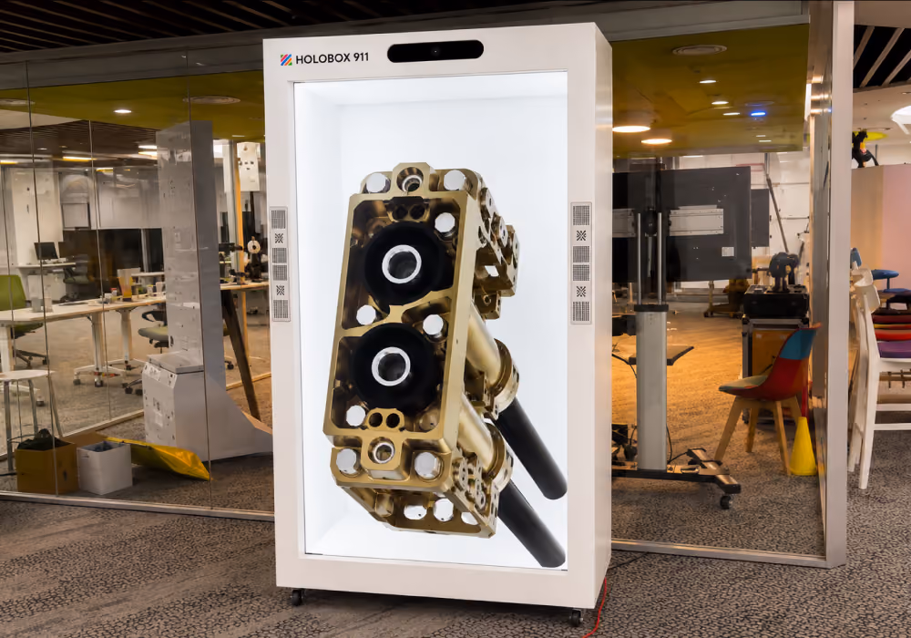 HoloBox 3D hologram display showcasing a detailed automotive component in a showroom