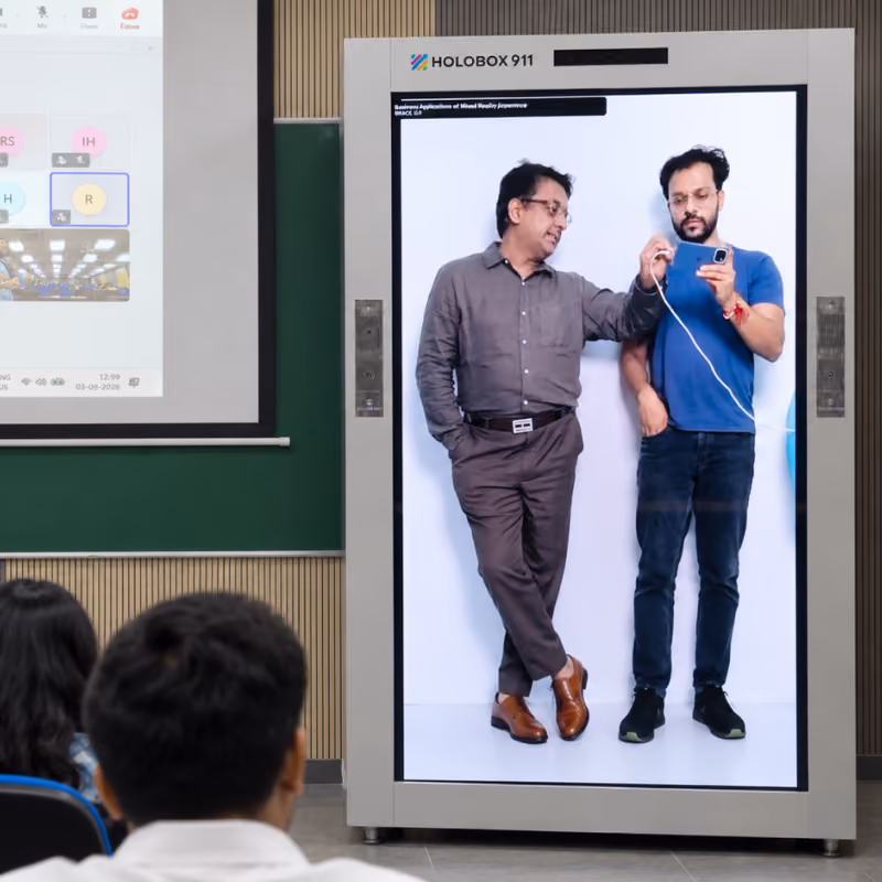 Two remote guest speakers appearing live in HoloBox911 at IMT Ghaziabad