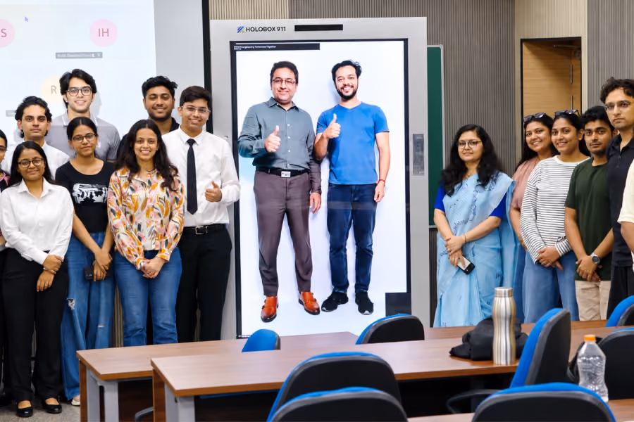 Students experiencing a life-size AI educator on HoloBox911