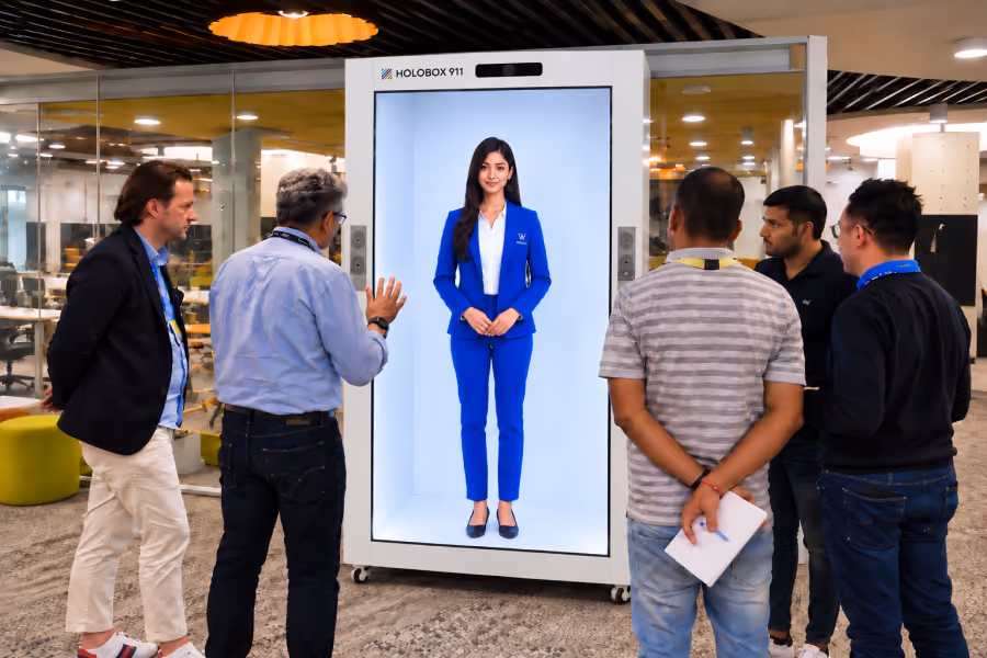 Corporate visitors experiencing a HoloBox911 3D hologram display