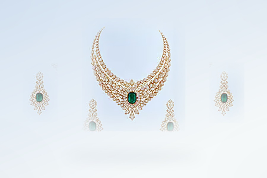 Concept visual: necklace revealed alongside its matching pair of drop earrings