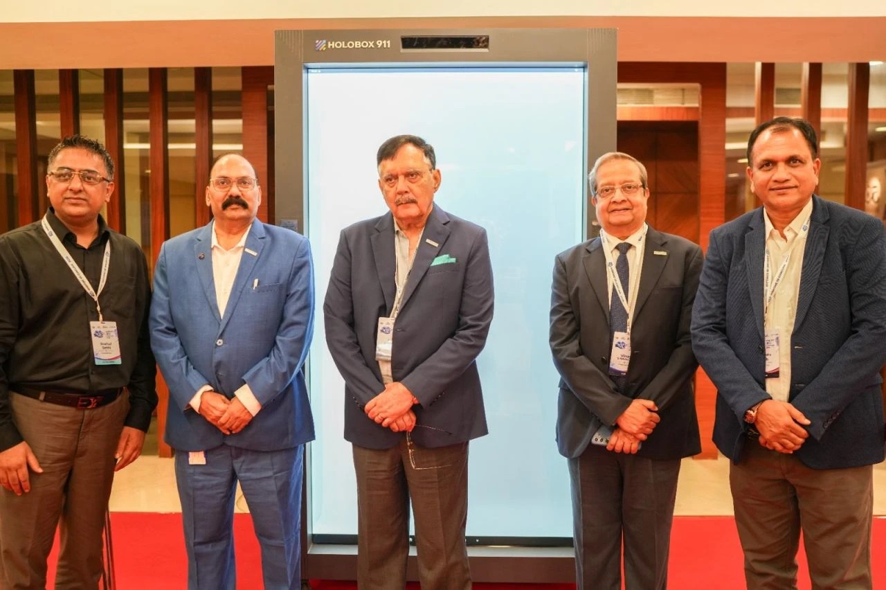 Delegates beside the HoloBox911 holographic display on the exhibition floor at Maritime XR Conclave 2026, Indian Register of Shipping, Mumbai