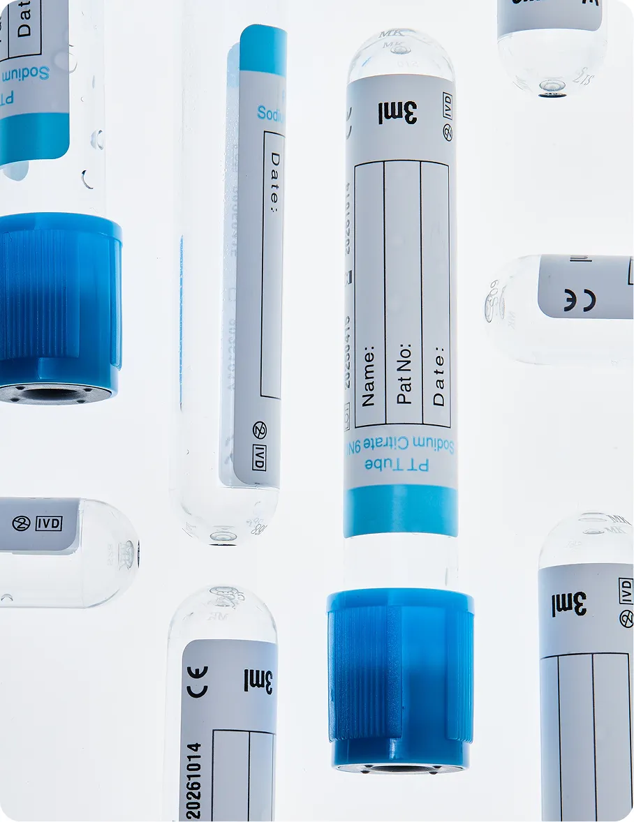 Close-up of multiple clear 3 ml sodium citrate blood collection tubes with blue caps and blank labeling fields.