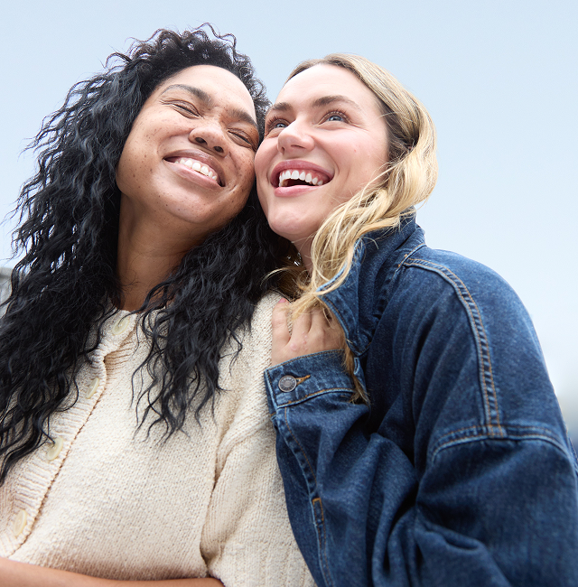 Two women smiling together outdoors