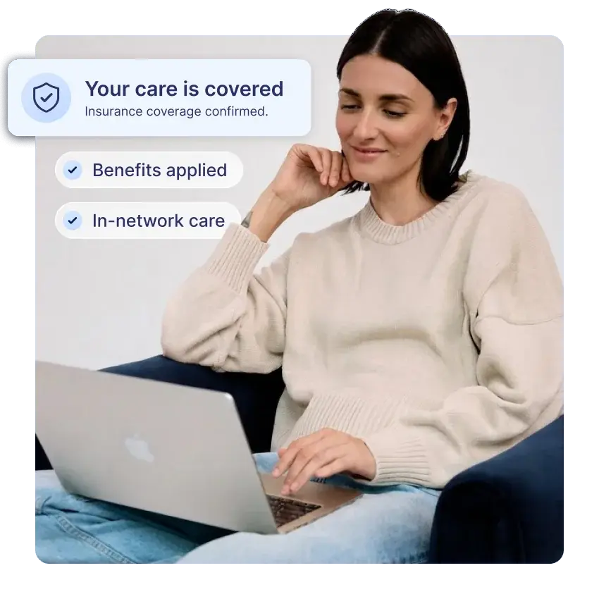 Woman smiling at her laptop beside a confirmation card reading: Your care is covered. Insurance coverage confirmed. Benefits applied. In-network care.