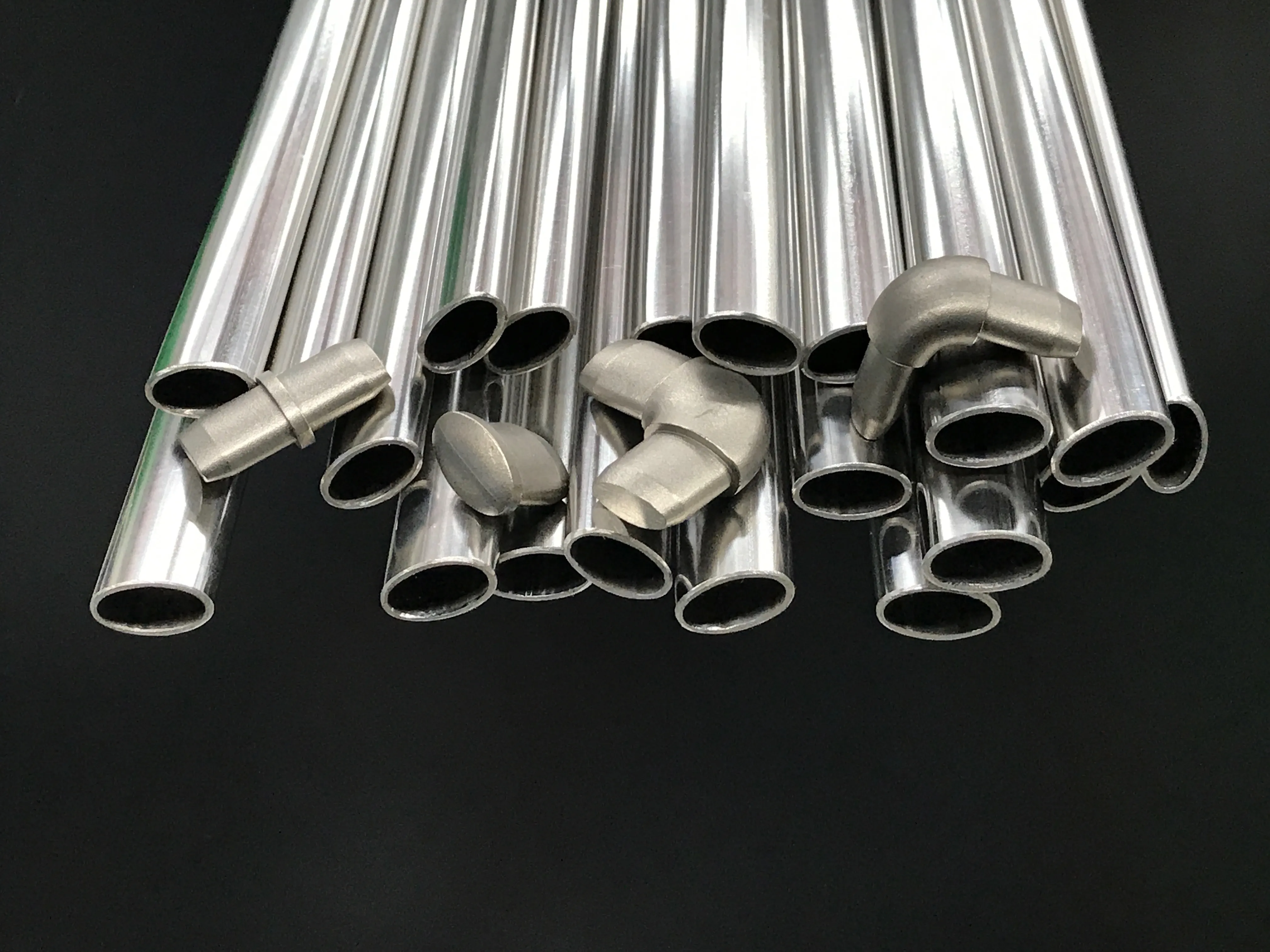 multiple lengths of 23.5mm by 13.3mm stainless steel tube with straight joiners