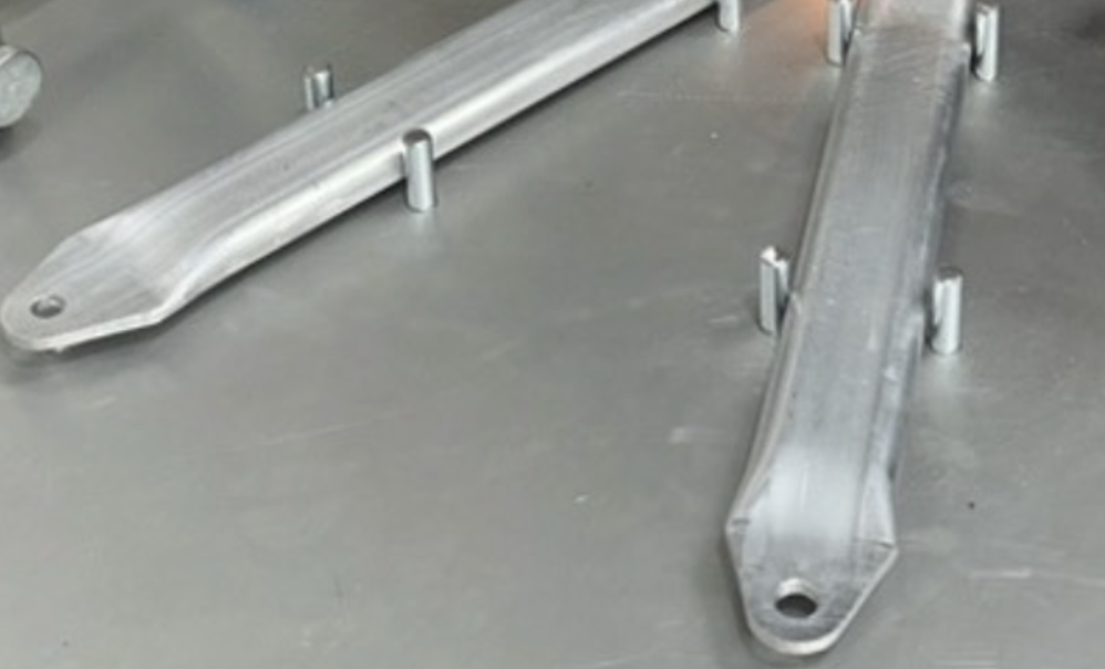 Aluminium flat-sided oval tube with pressed and drilled tube ends, showing how flat-sided oval tubing can reduce the need for additional brackets and fixings