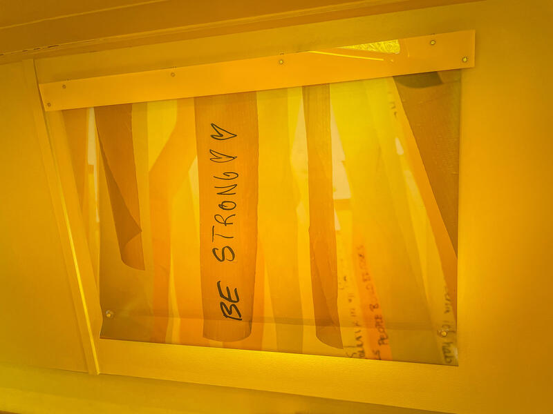 An all yellow colour drench room design with custom yellow printed blinds.