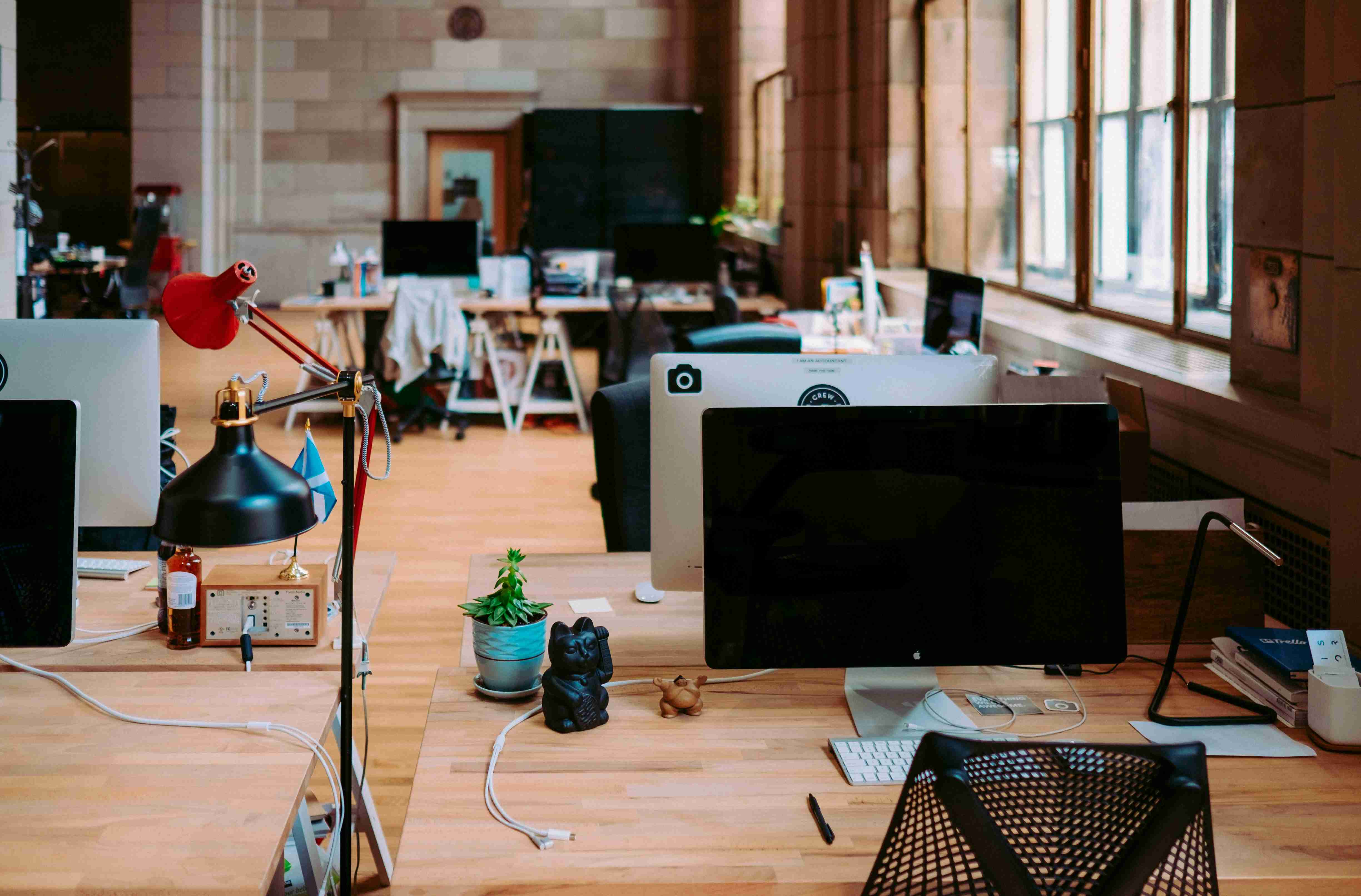 A modern office with wooden furniture.