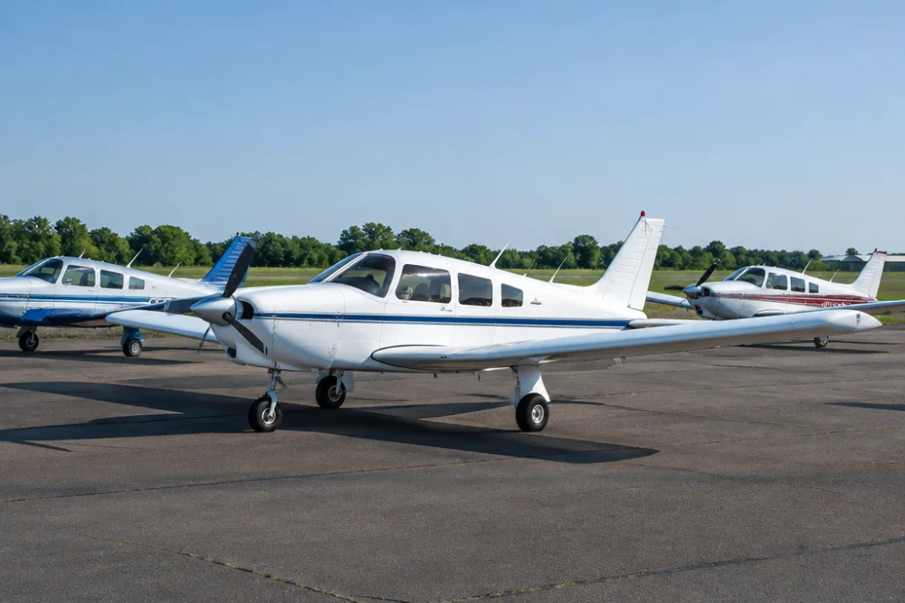 Piper Archer training aircraft parked on a flight school ramp