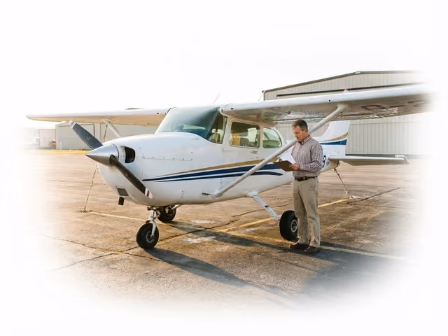 Aircraft owner reviewing insurance policy on the ramp