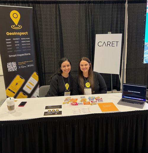 Two Caret team members at a tradeshow