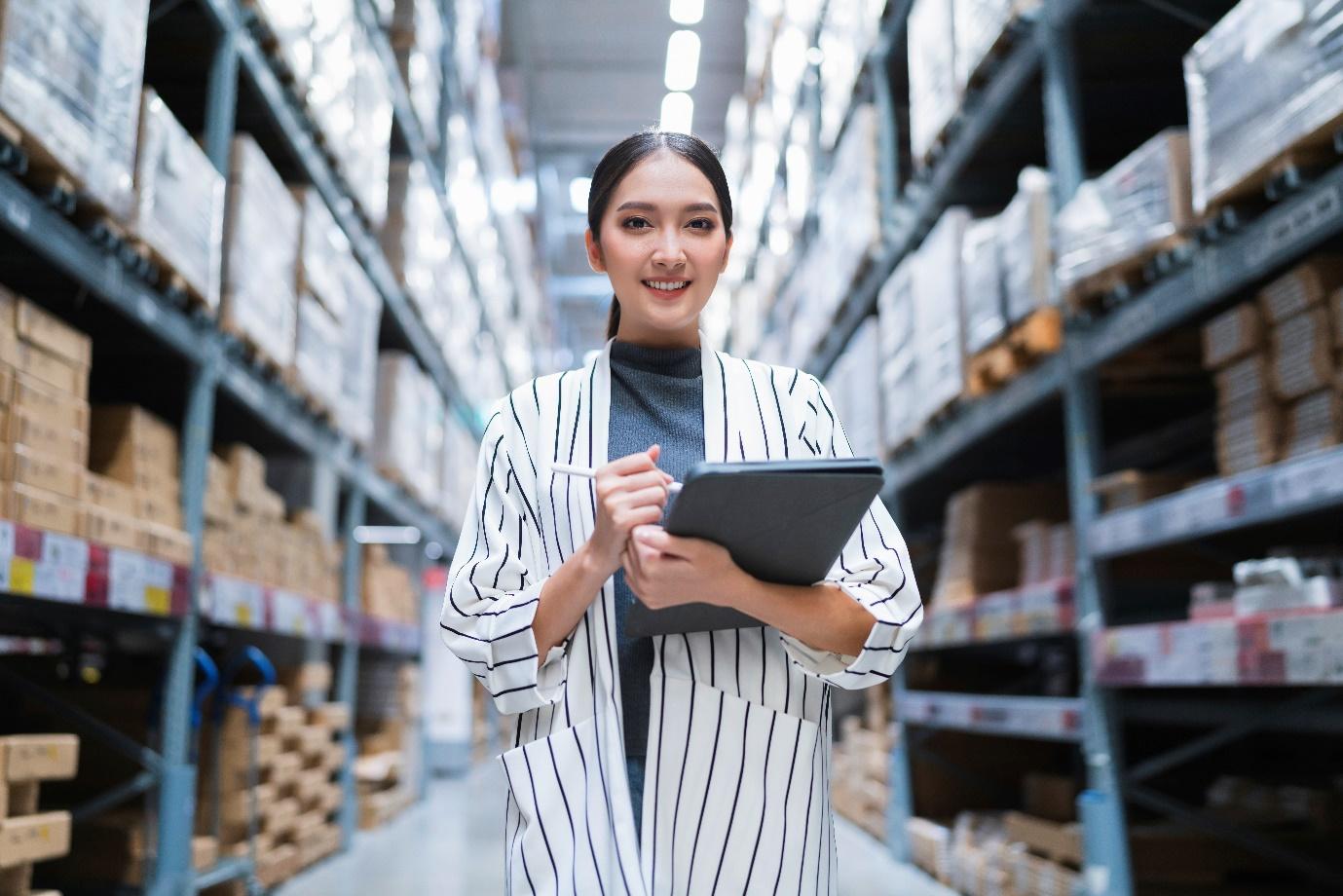 A woman standing in warehouse