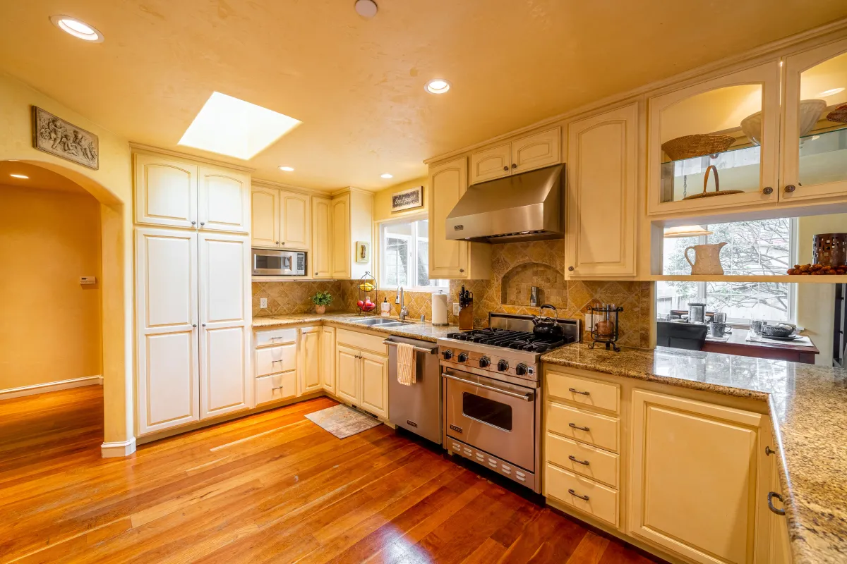 The fully stocked kitchen with a Viking stove, dishwasher, and fridge.
