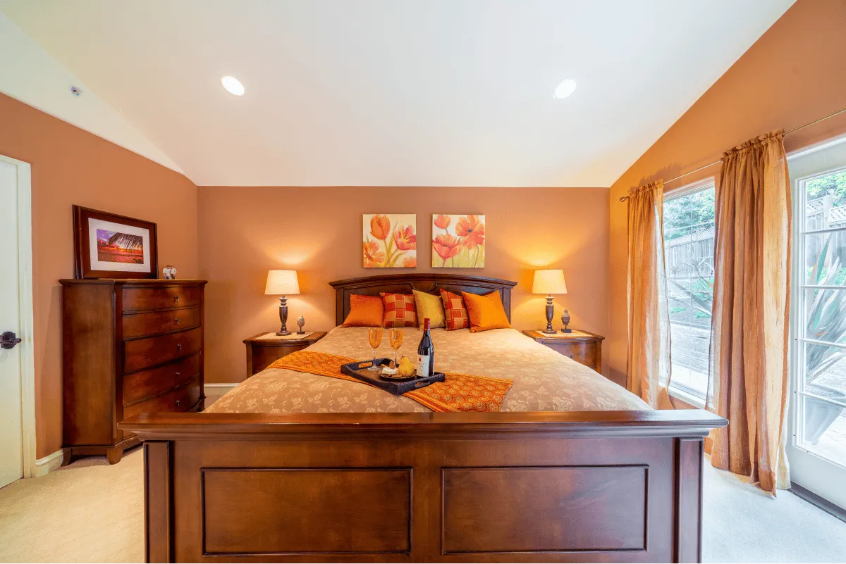 A wide view of the king sized bed in the master suite and the amenities for when you stay.