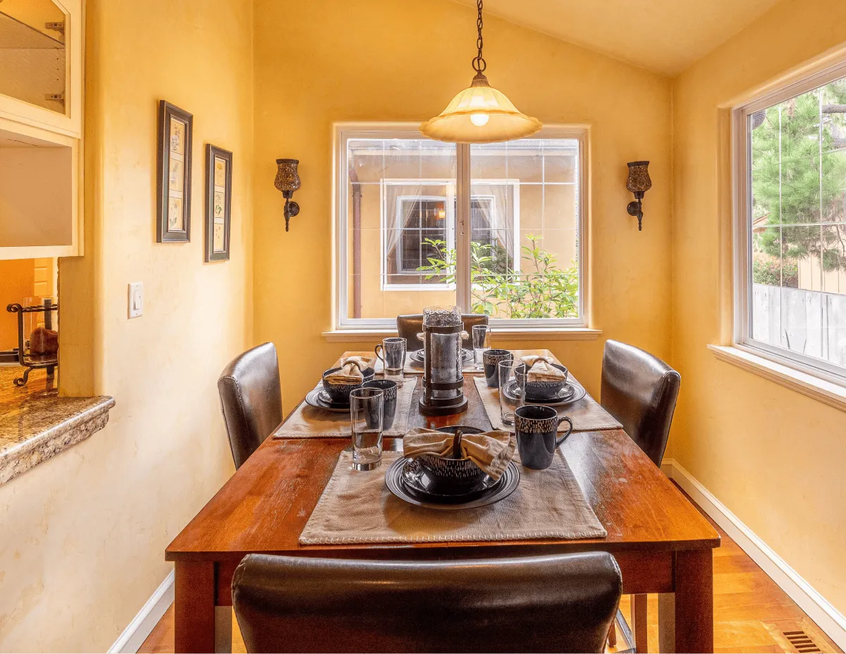 The dining nook attached to the living room, a casual dinner area.