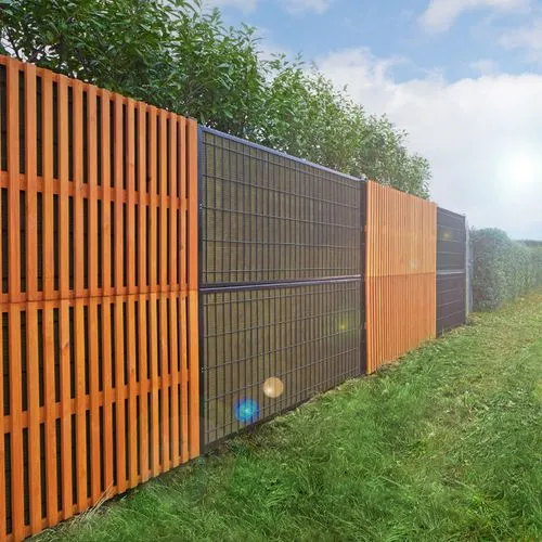 A sound absorbing fence with steel frame cladding and metal frames installed along a grassy yard