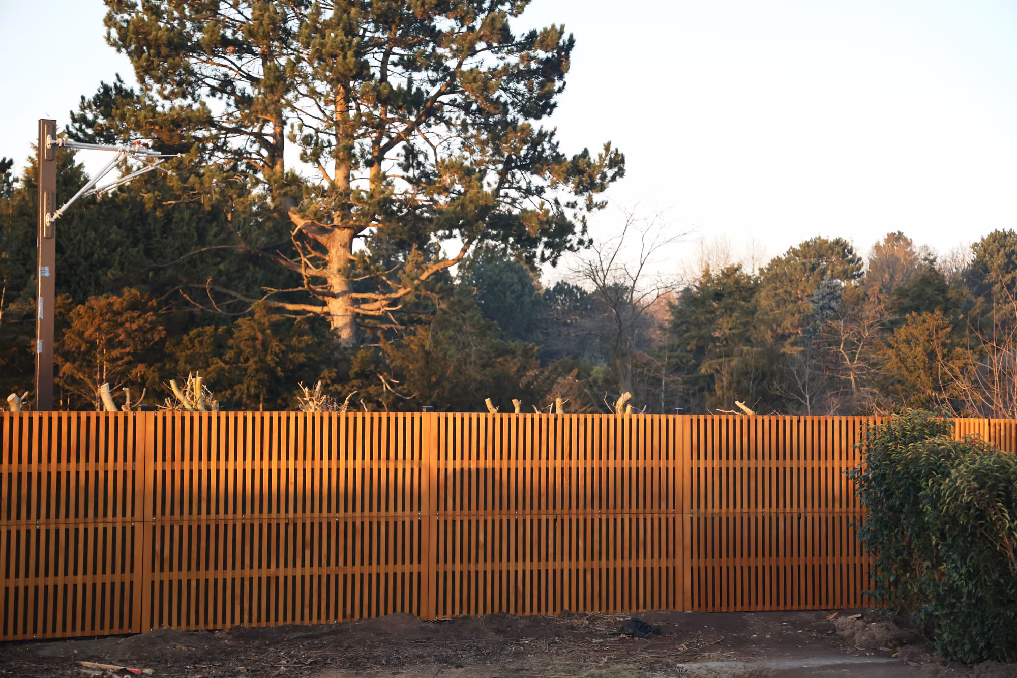 Noistop Essential acoustic fence with wooden cladding in a private residential garden area