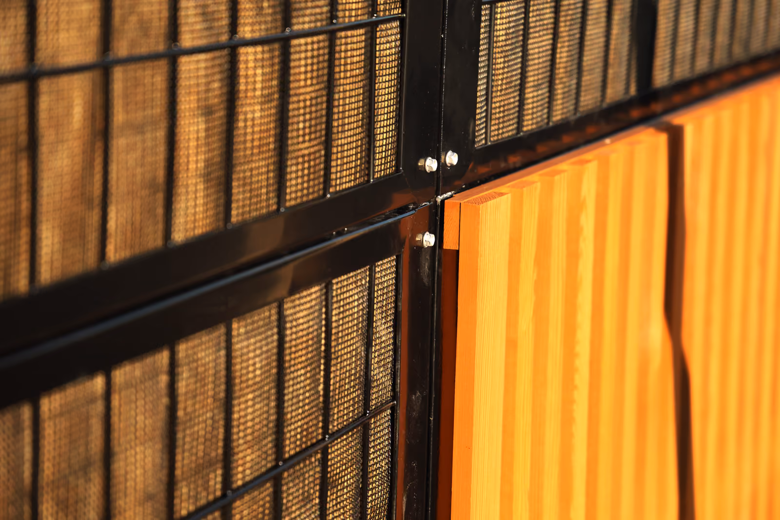 Noistop Essential acoustic fence with brown wooden cladding