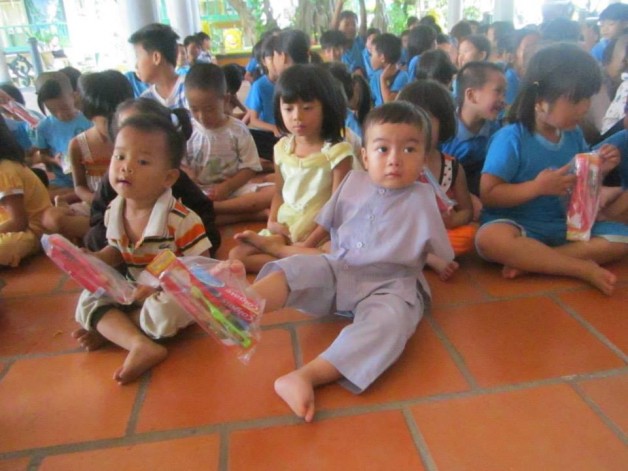 Children holding supplies