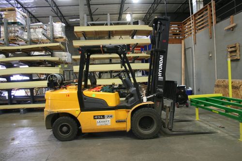 Yellow forklift in the warehouse