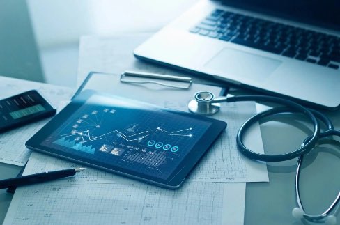 Medical tools and laptop on desk