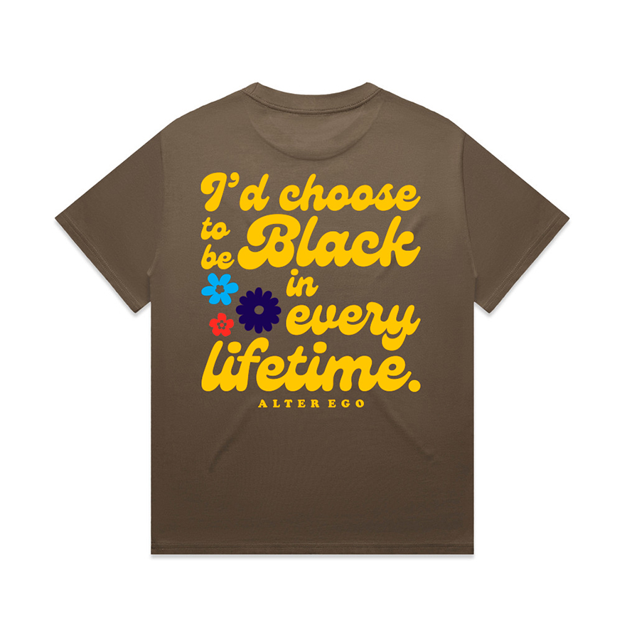 Walnut colored heavyweight graphic t-shirt with the phrase I'd Choose to be Black in Every LIfetime on the back in yellow script font, and three flowers